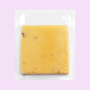 square block of cheese wrapped in sealed plastic